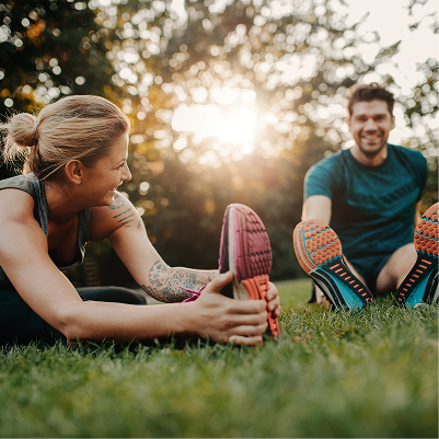 Couple Stretching Outdoors