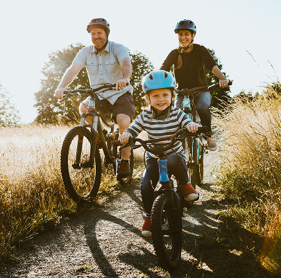 Family Riding Bikes Outdoors